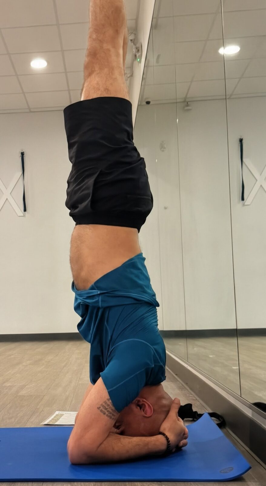 Raj in bound headstand, side view